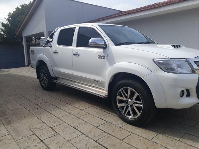 Hilux SRV 3.0 D-4D 2014 bx Km impecável Acessórios - Foto 4