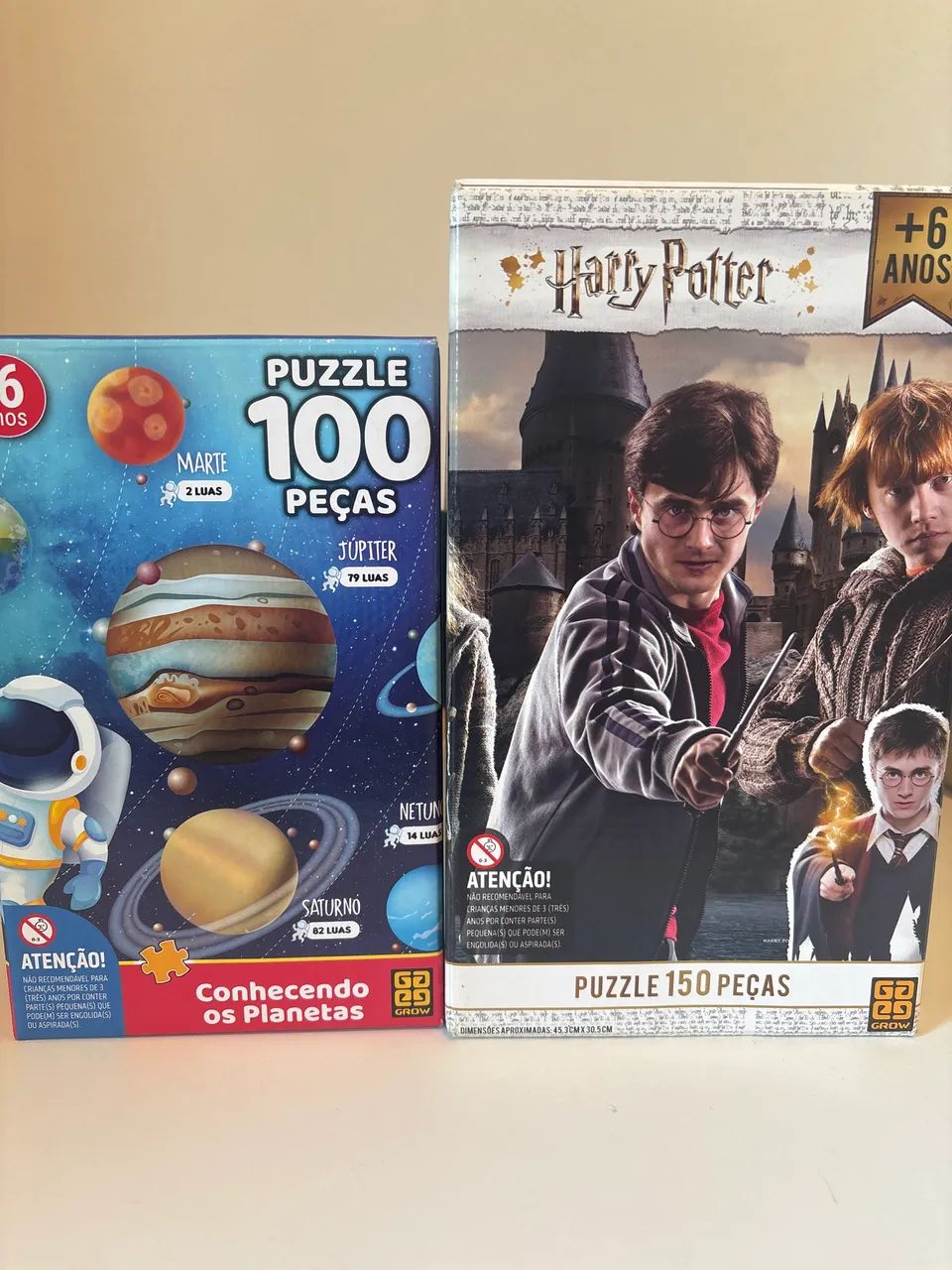 Kit dois quebra cabeças: 100 e 150 peças astronauta e harry potter