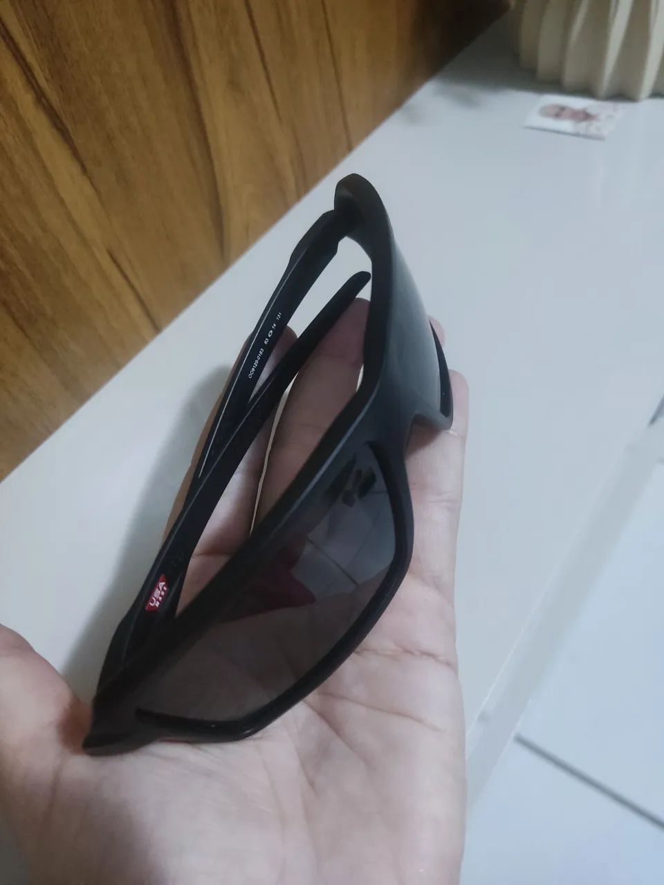 Óculos de sol preto Oakley original novo e com nota - Foto 4