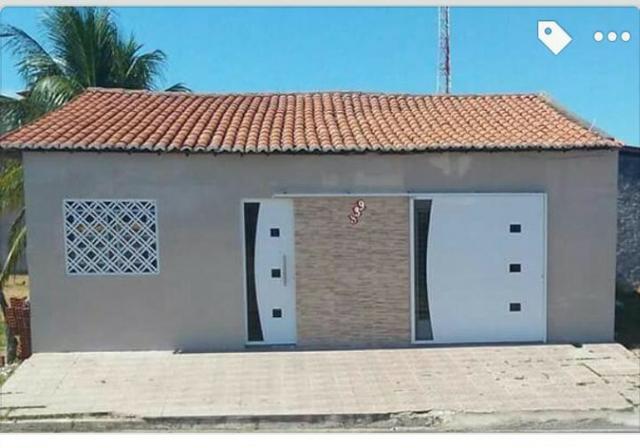 Casa com três quartos, suíte, garagem, área de serviço