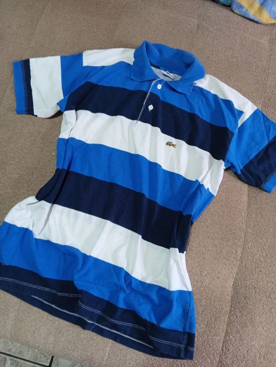 Camisa polo Lacoste P listrada