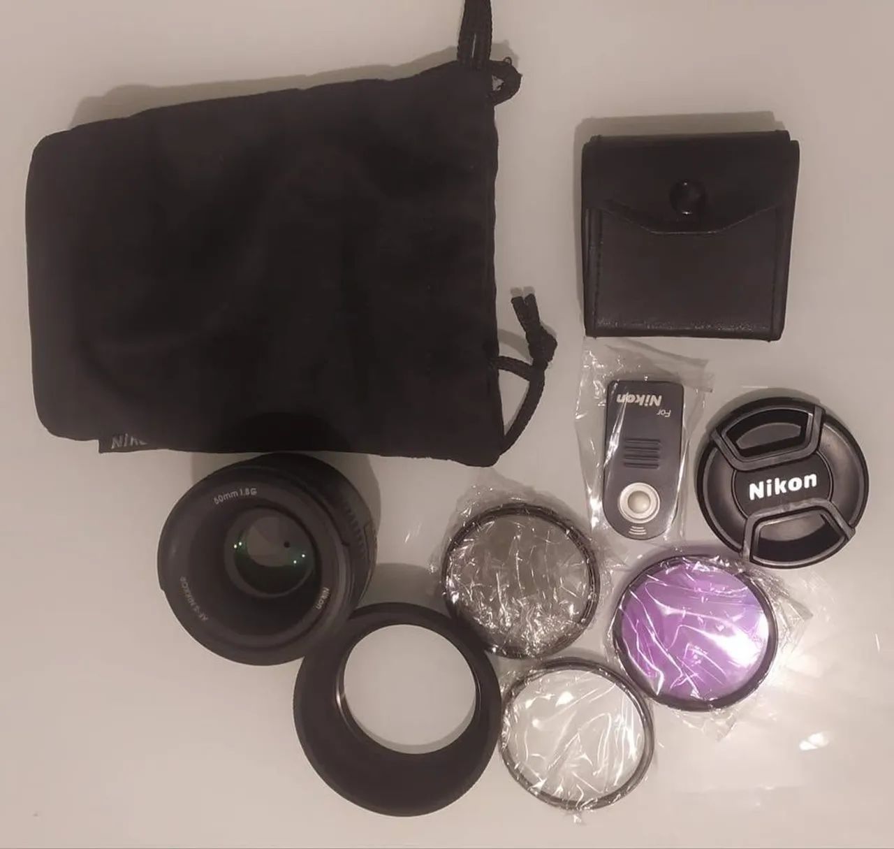 Lente Nikon 50mm 1.8G com acessórios<br>