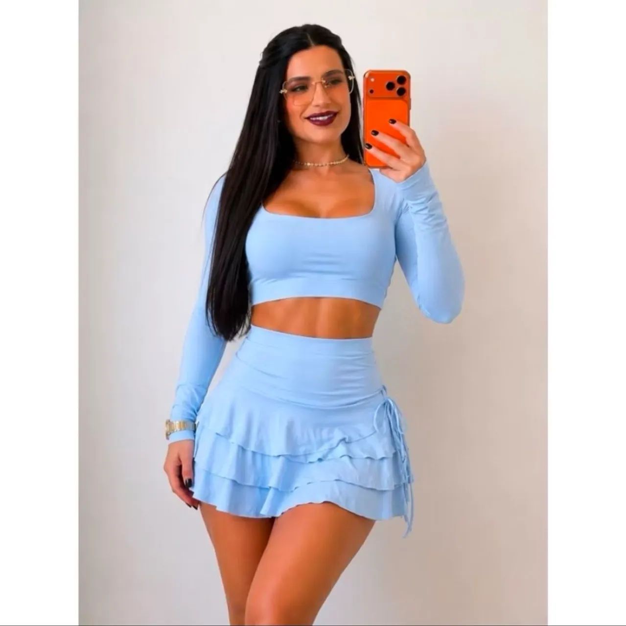 Conjunto feminino cropped manga longa e short saia