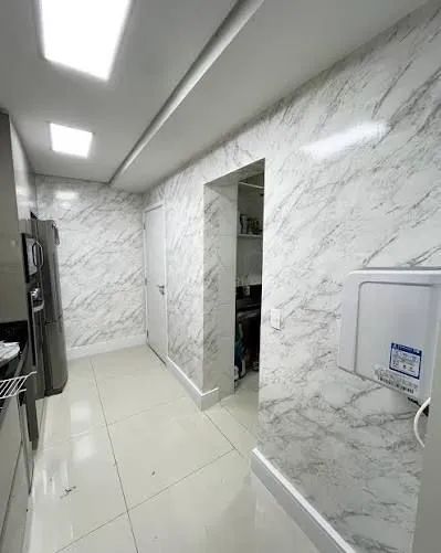 Instalador de papel de parede