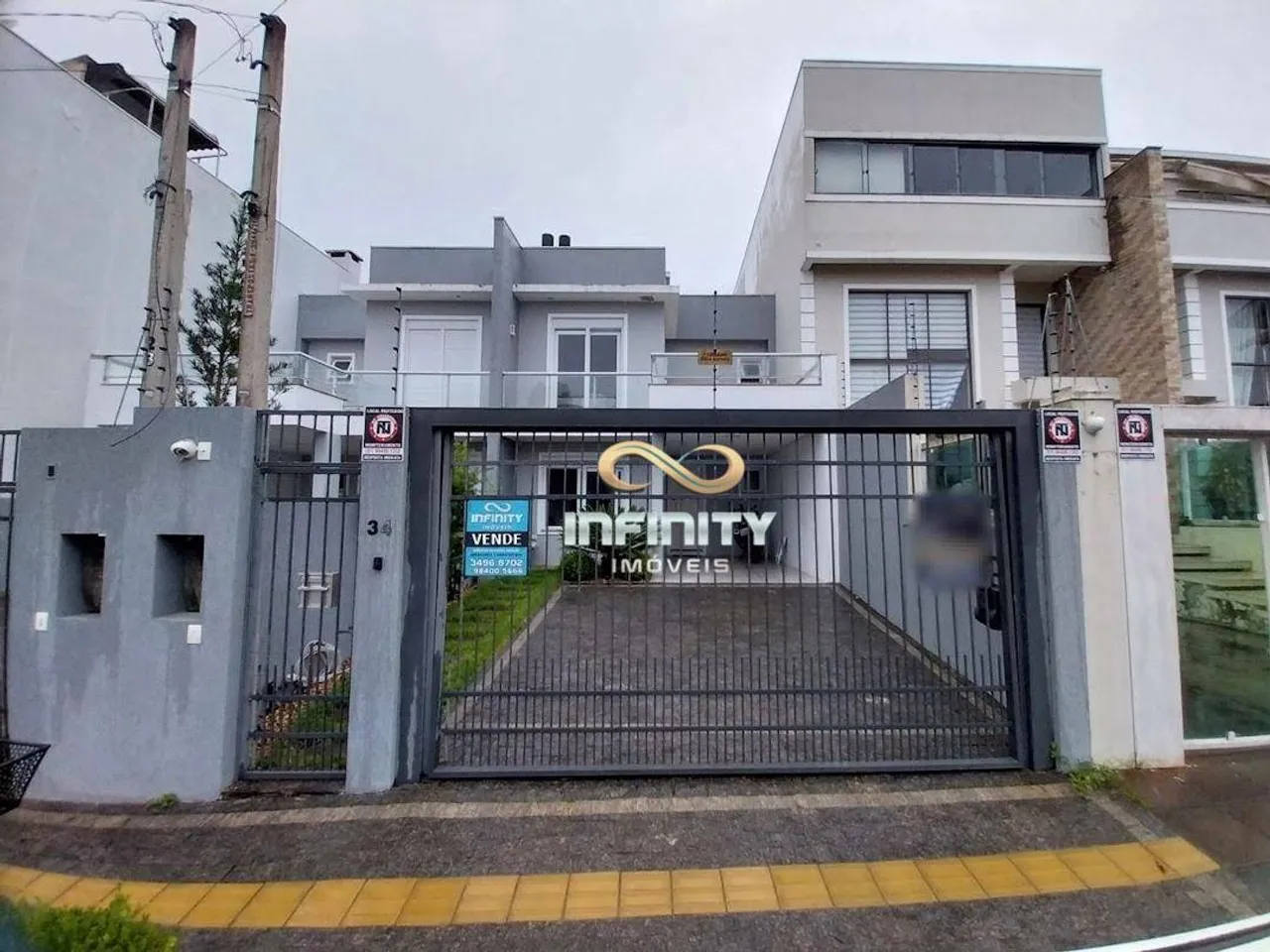 Sobrado com 3 dormitórios à venda, 132 m² por R$ 990.000,00 - Dom Feliciano - Gravataí/RS