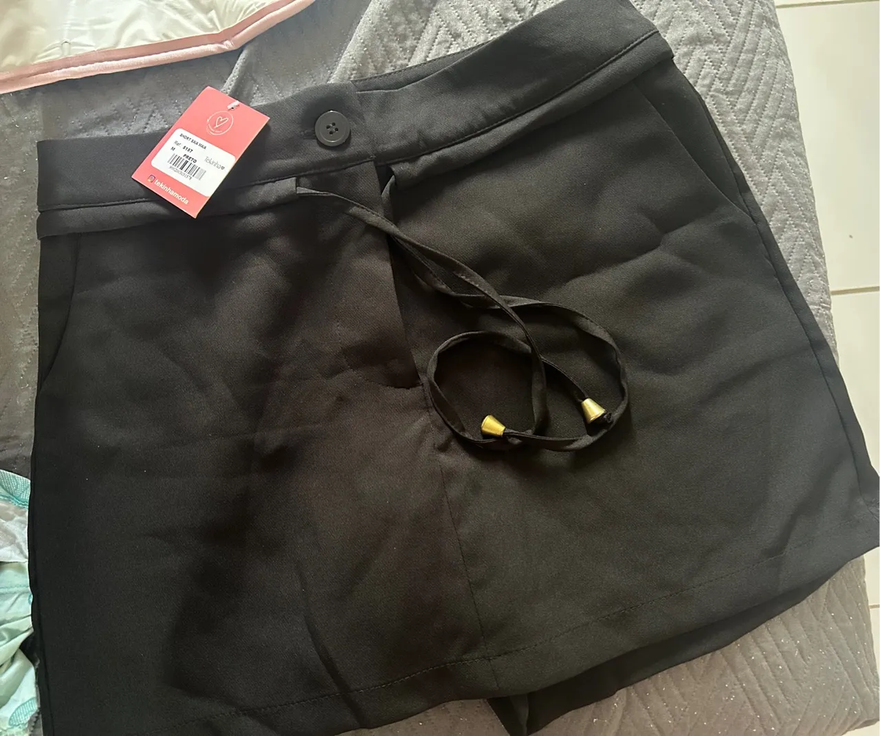 Short saia preto feminino