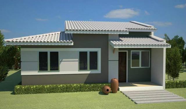Casa com três quartos sendo uma suíte/ traga seu terreno