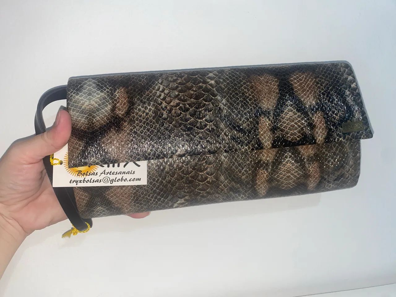 Bolsa clutch animal print cobra NOVA