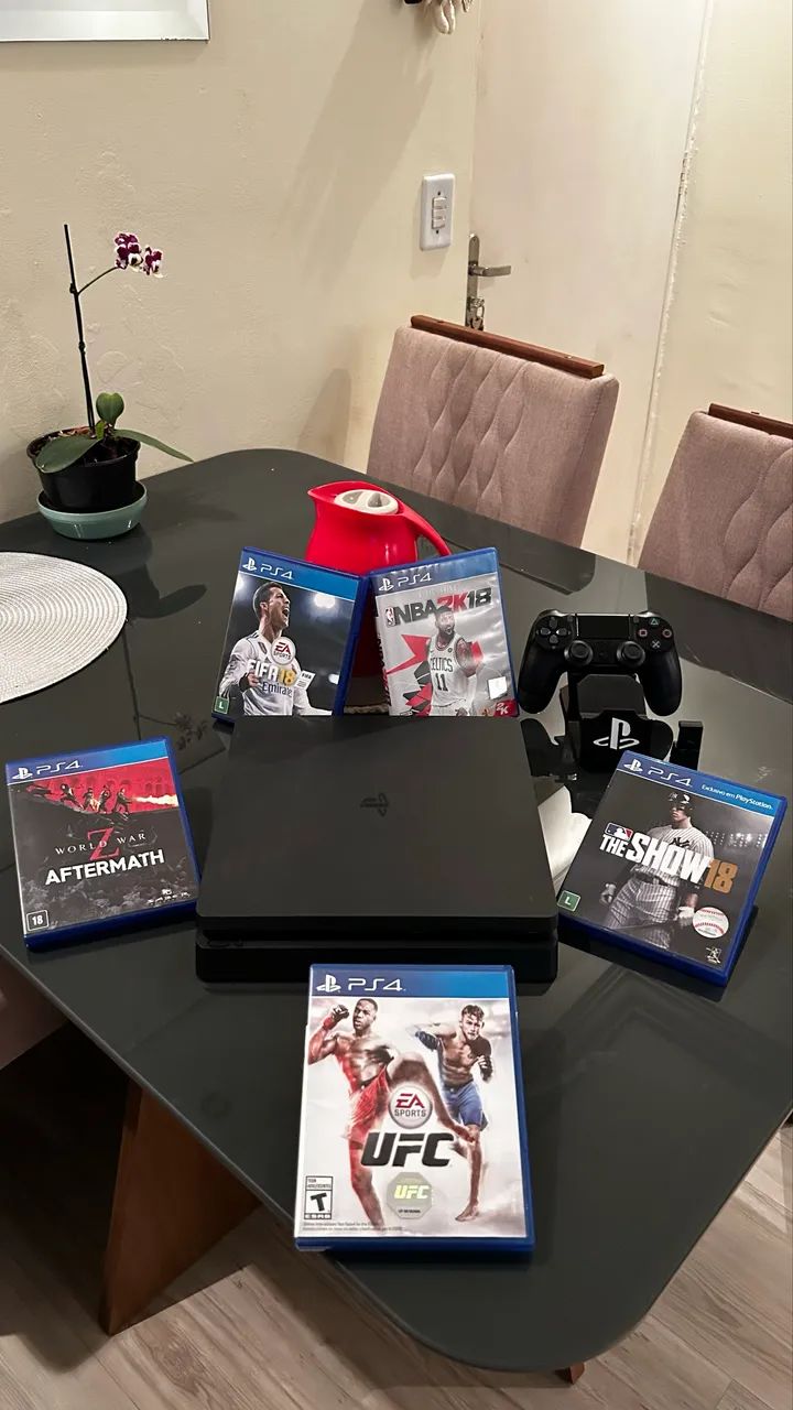 Vendo PS4 (1TB) com 9 jogo (God of War ragnarok)lacrado