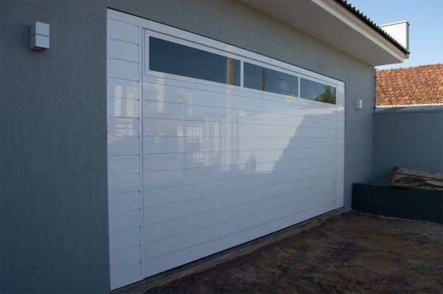 Porta basculante de contra pesos 