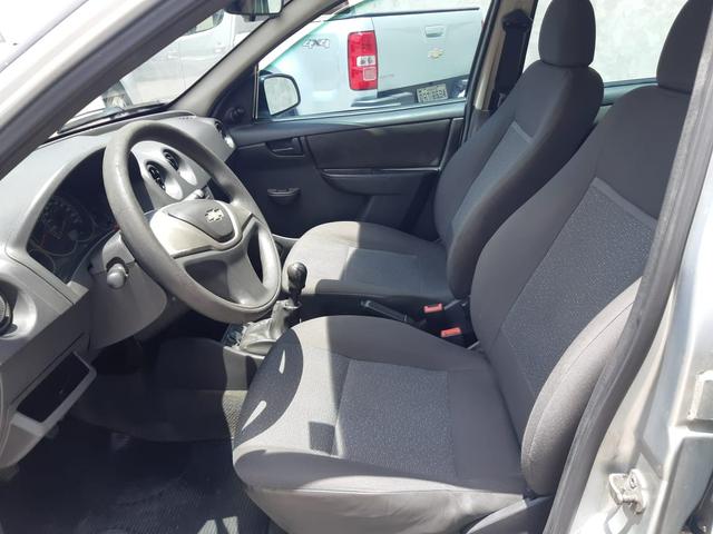 Celta LS 1.0 flex, completo, 04 portas, pneus novos - Foto 6