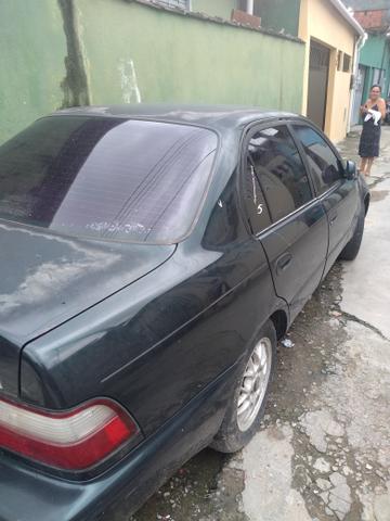 Vendo ou troco. um corola 96 com u motor travado fauta de Óleo - Foto 3