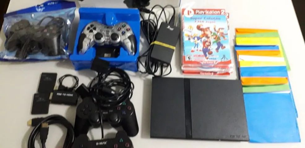 playstation 2 com otimo estado  com caixa, 4 controles, 23 jogos, 2 memory card - Foto 3