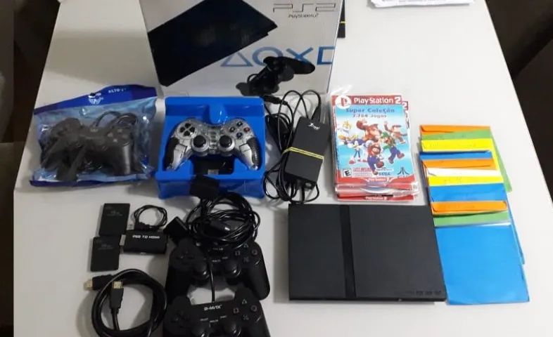 playstation 2 com otimo estado  com caixa, 4 controles, 23 jogos, 2 memory card - Foto 4
