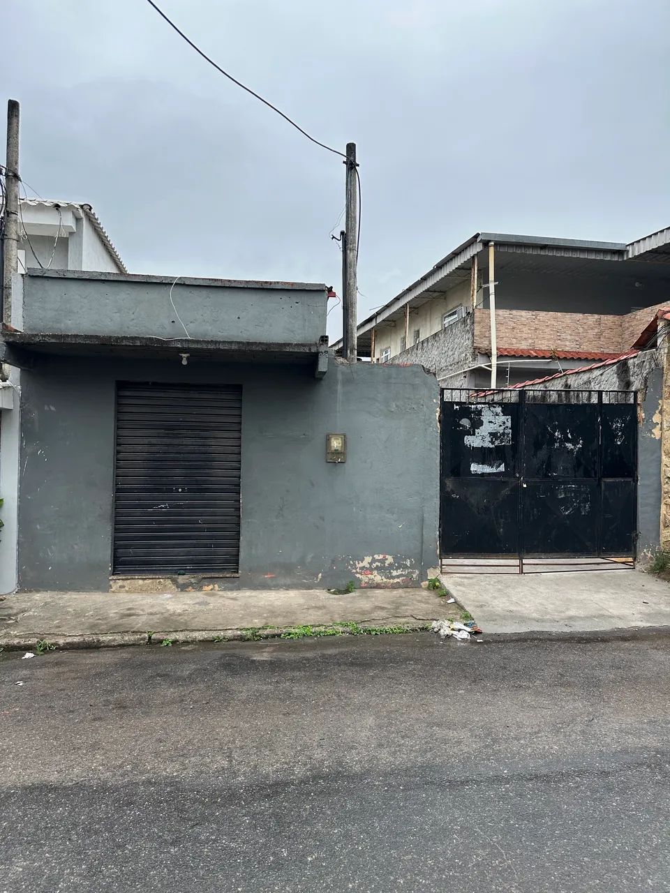 VENDO TERRENO  COM LOJA TODO MURADO 