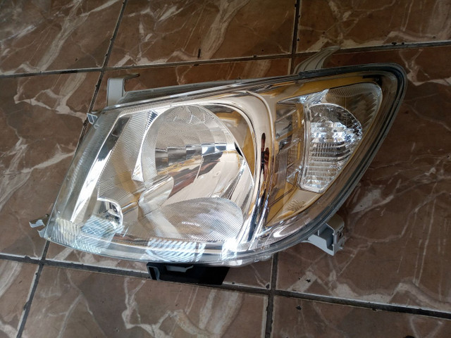 Farol esquerdo Toyota Hilux Srv 2006 / 2011