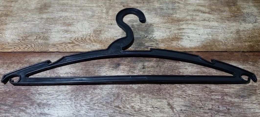 Black plastic adult hangers. Ideal for commercial stores; in excellent condition, I have many available
