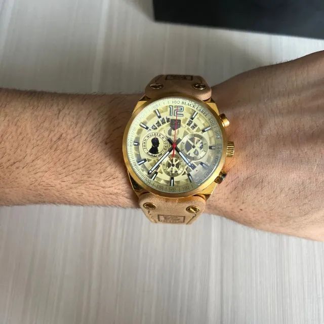 RELÓGIO TAG HEUER JOHN WALKER DOURADO COURO 45MM