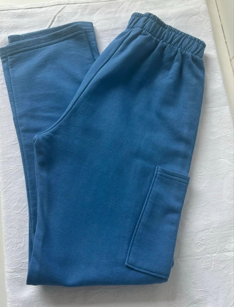 Calça de moletom infantil azul claro com bolso lateral Kyly 