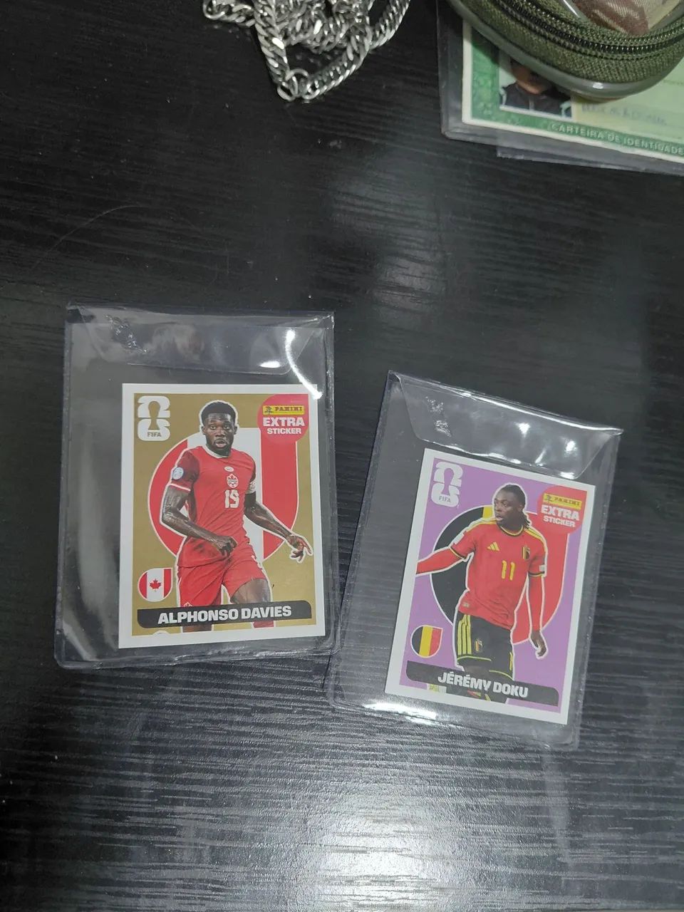 ALPHONSO DAVIES OURO/JEREMY DOKU REGULAR (ROXA) LEGENDS COPA 2026 PANINI
