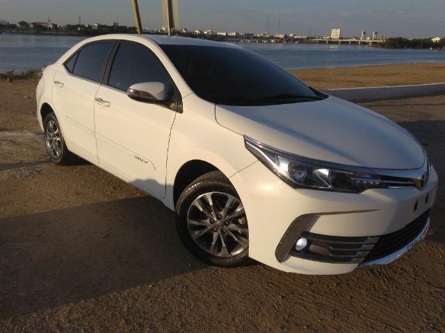 Vendo ou troco em carro de valor ate 30 mil,este corolla gli 2018 com acessorios do xei - Foto 12