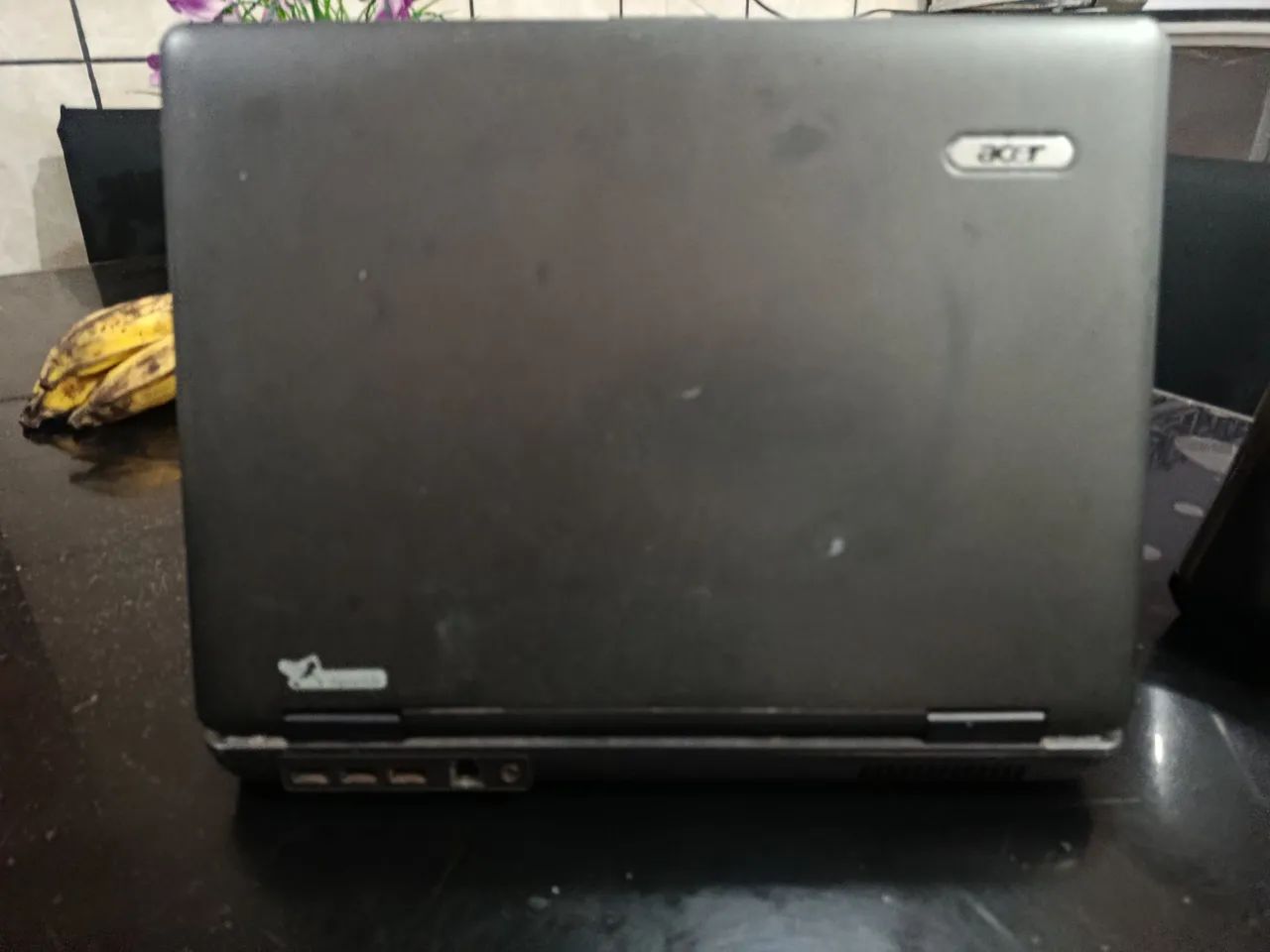 Este é um notebook Acer Extensa, provavelmente um modelo das séries 5220 ou 5620.  - Foto 3
