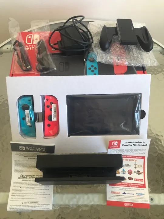 VENDO um Nintendo switch na caixa.