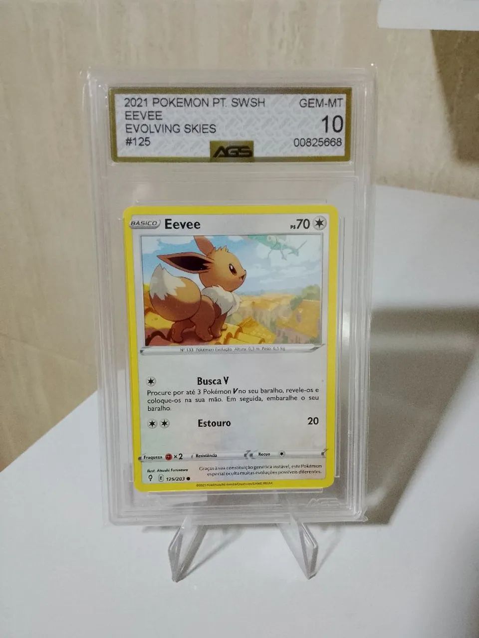 Eevee Evolving Skies 125/203 - Nota AGS 10 GEM-MT - Carta Graduada