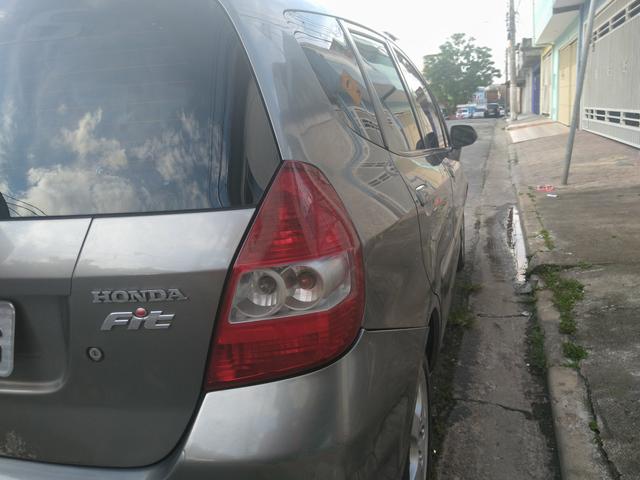 Honda fit 2006 bem abaixo da tabelars 15.000 carro com passagem de leilão