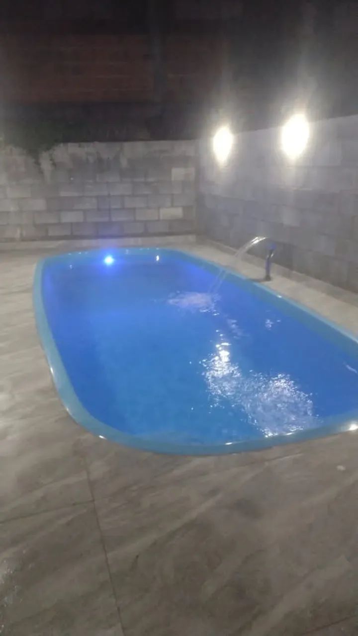 CASA COM PISCINA CARAGUA