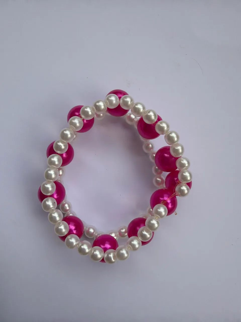 Pulseira rosa trançada