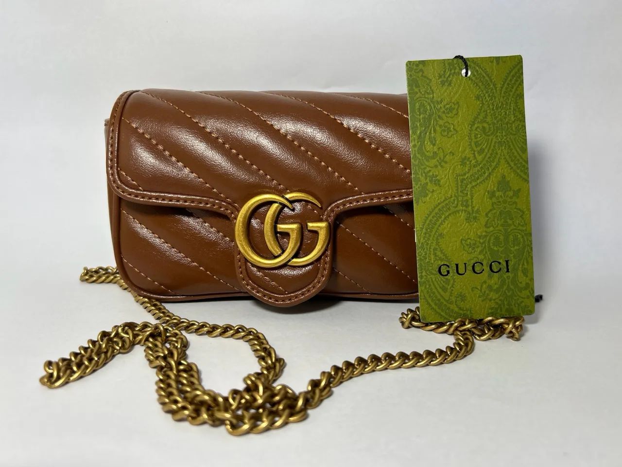 Bolsa Gucci GG Marmont Super Mini em Couro - Marrom - Foto 5