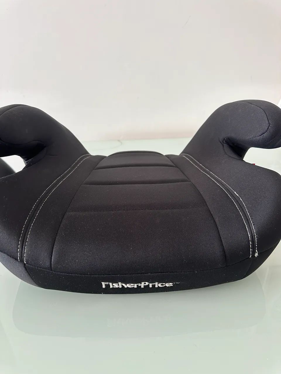 assento de elevação (booster) infantil Fisher-Price.