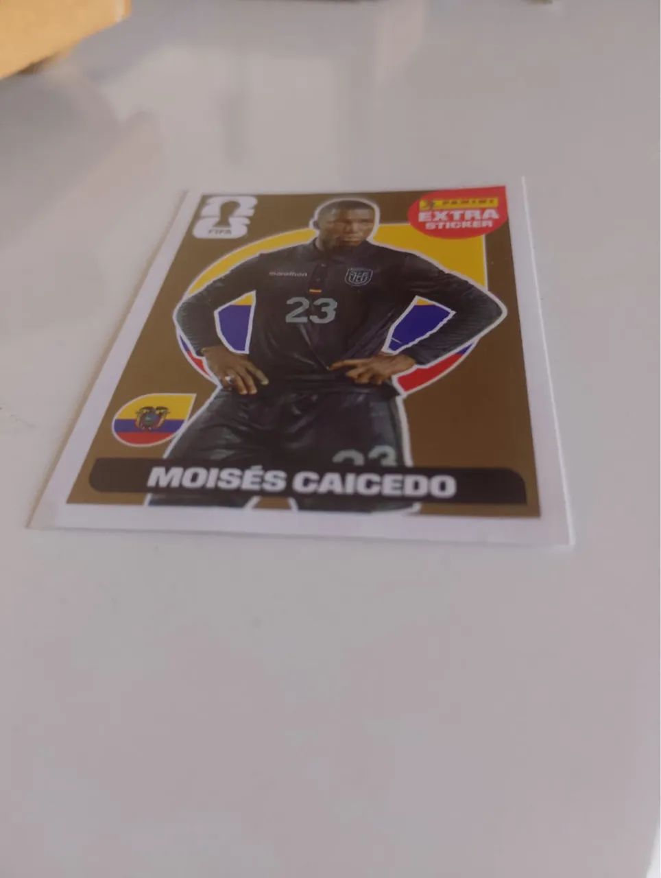 Figurinha extra sticker Moisés caicedo ouro
