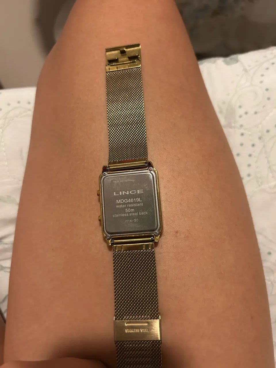 relógio lince dourado