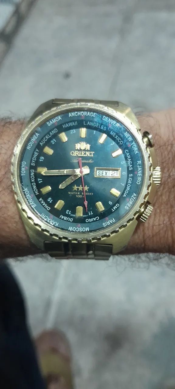Relógio orient automático horário mundial 