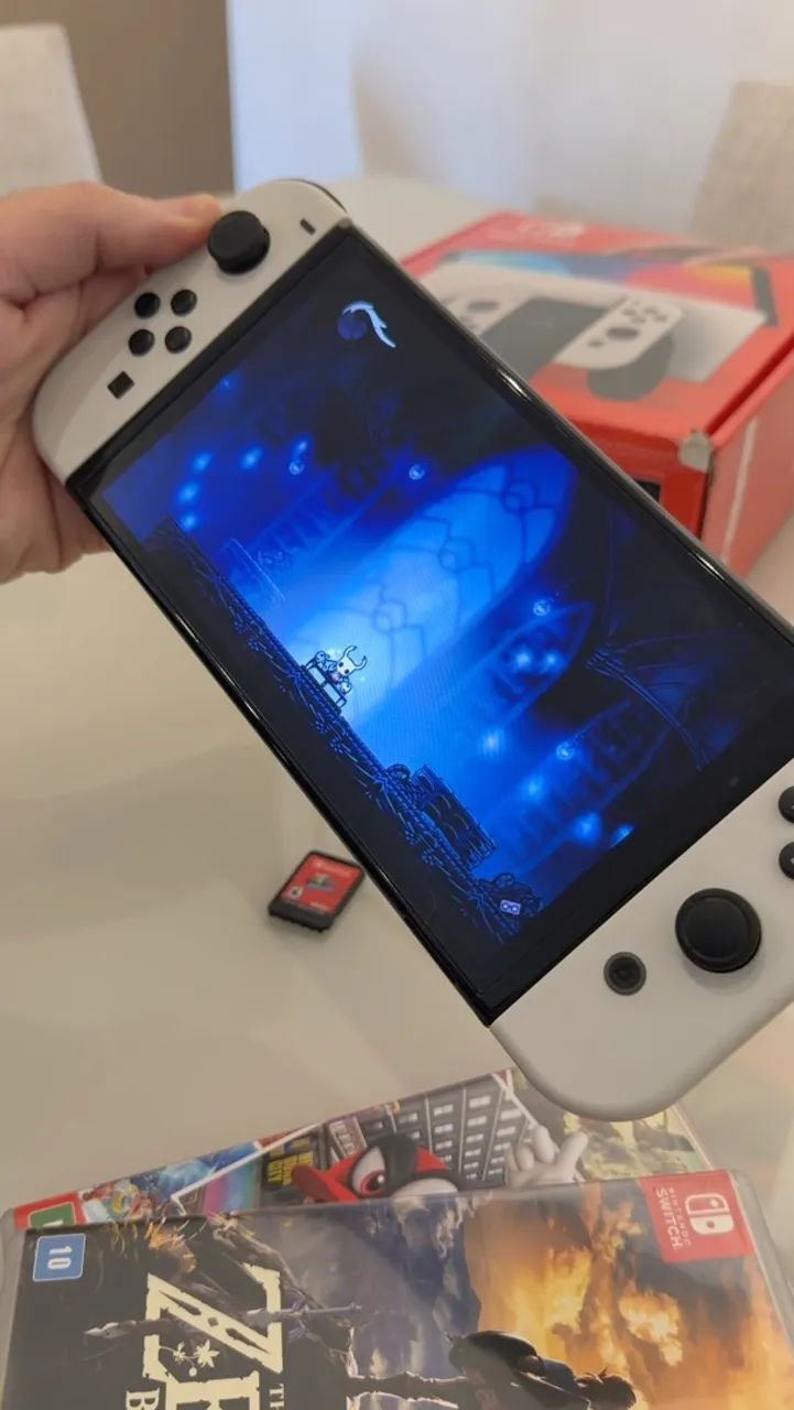 Nintendo Switch OLED + 2 Jogos + Case - Foto 4
