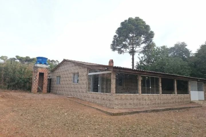 Terreno com casa 2 dormitorio.