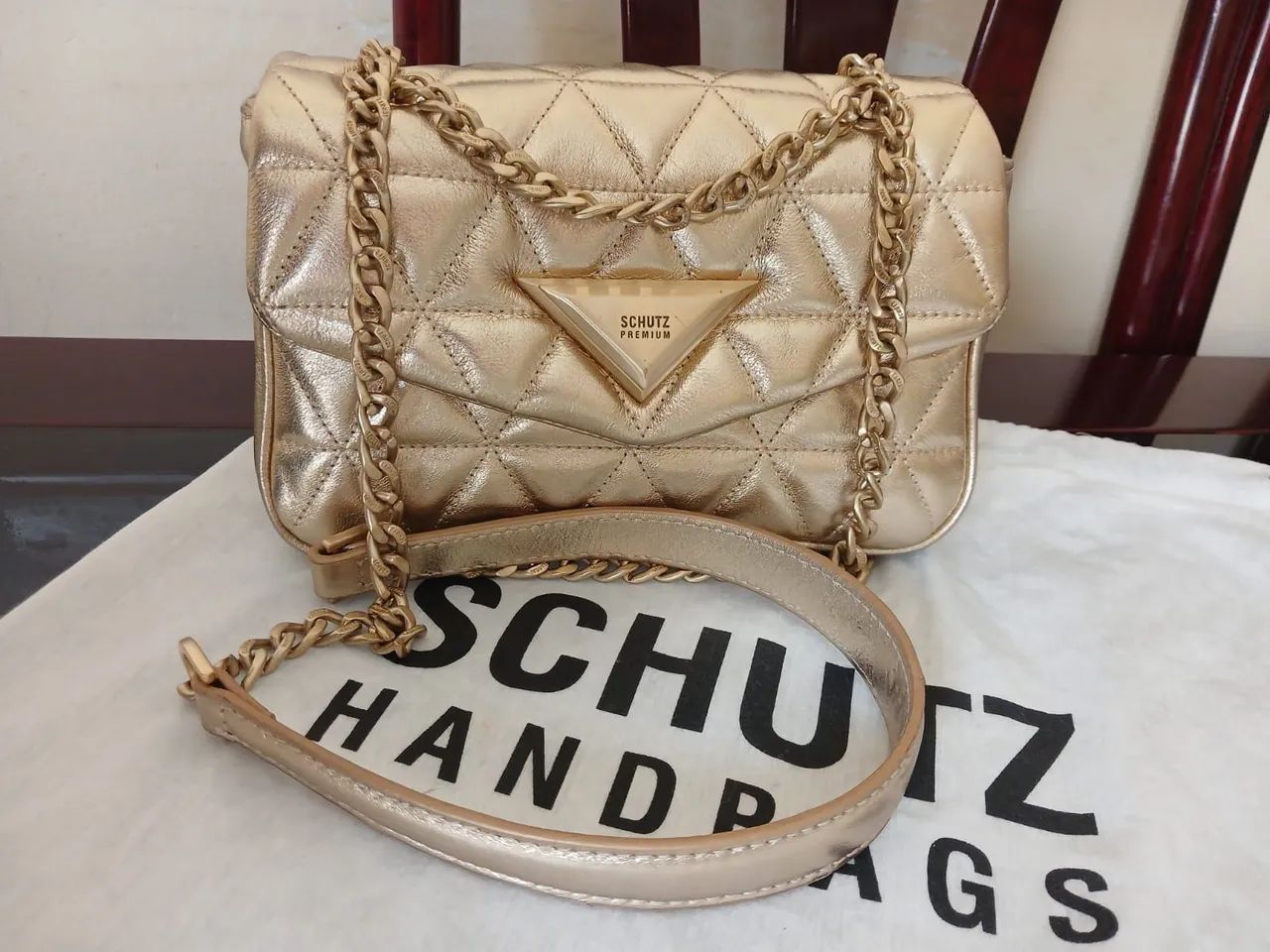 Bolsa dourada 944 schutz 