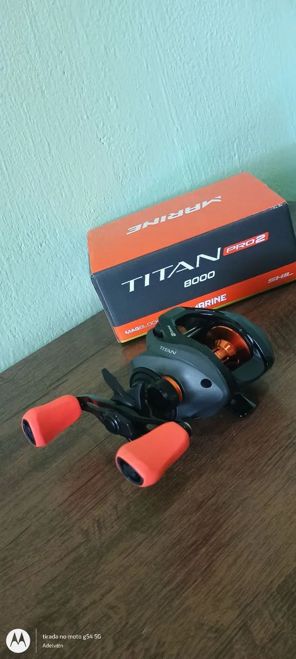 Carretilha de pesca titan pro 2 lado esquerdo  nova lacrada - Foto 2