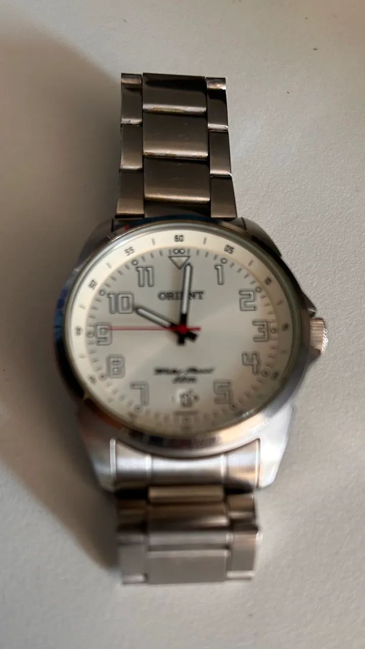 Relógio Orient quarts, pulseira metal  - Foto 4