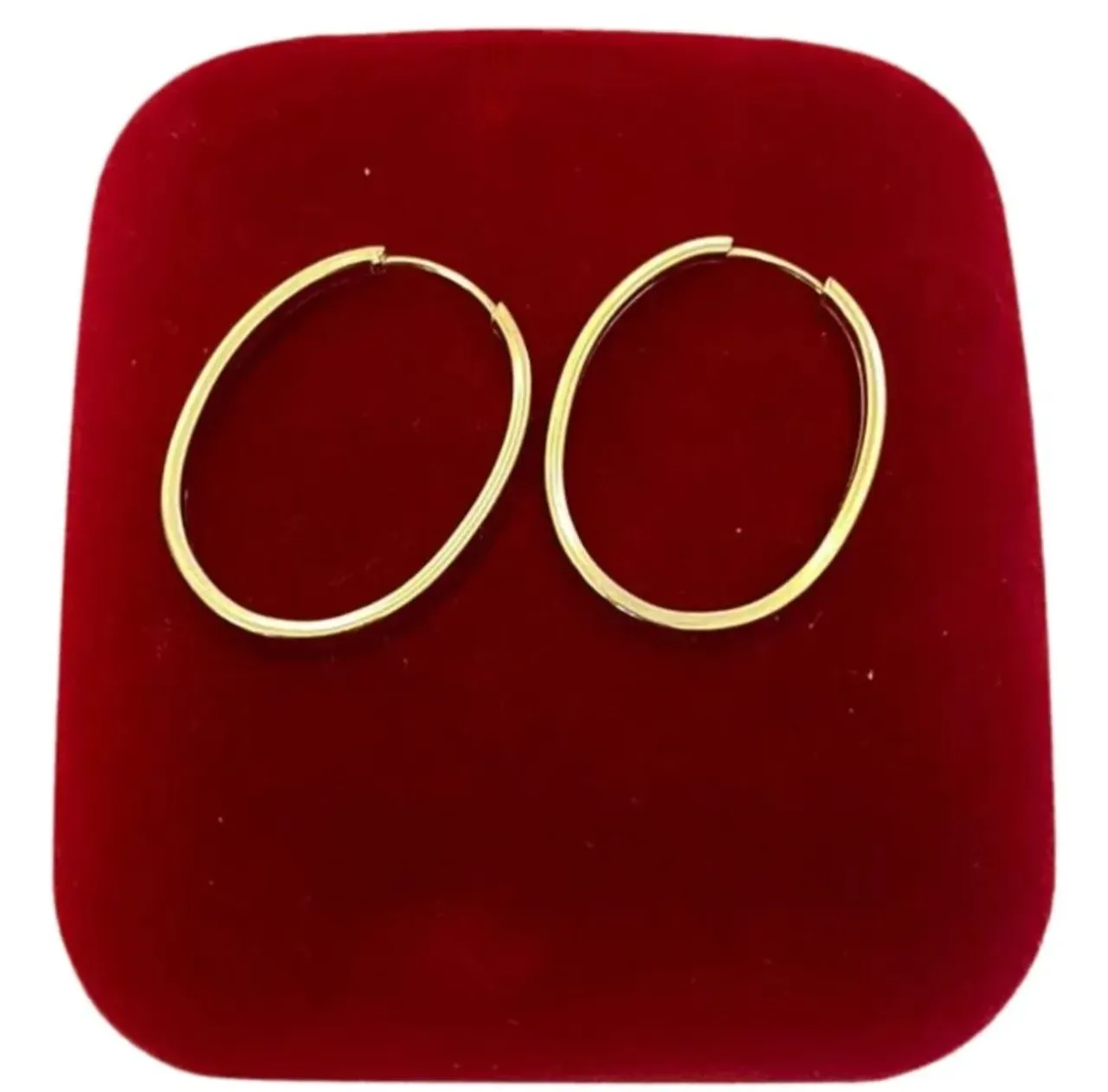 Argola de ouro média oval grossa 18k