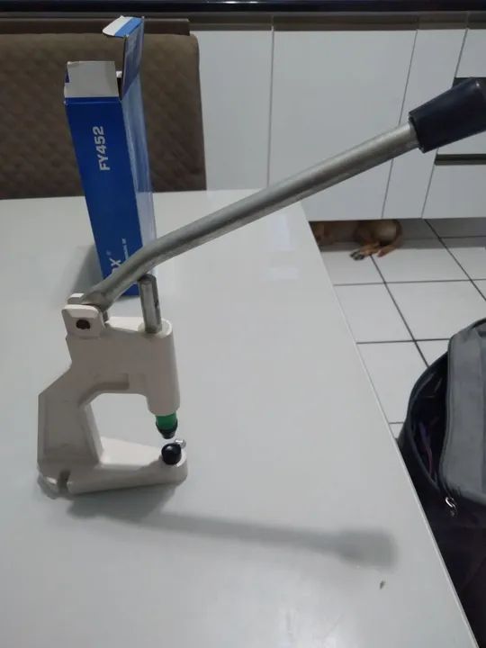 Pregador de botões manual 