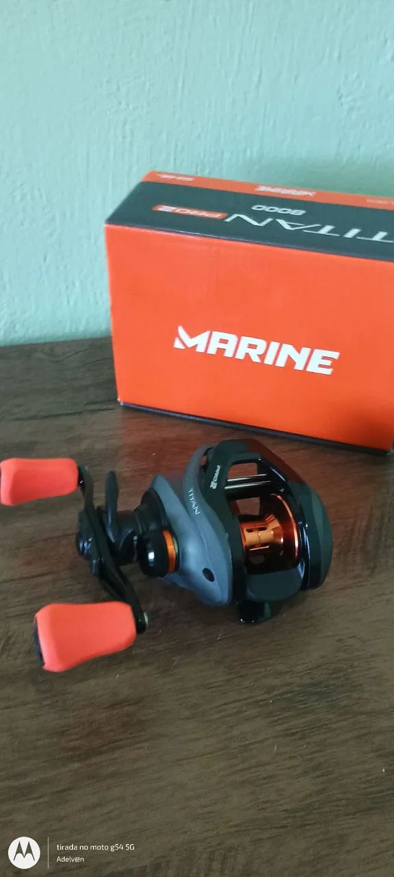 Carretilha de pesca titan pro 2 lado esquerdo  nova lacrada - Foto 3