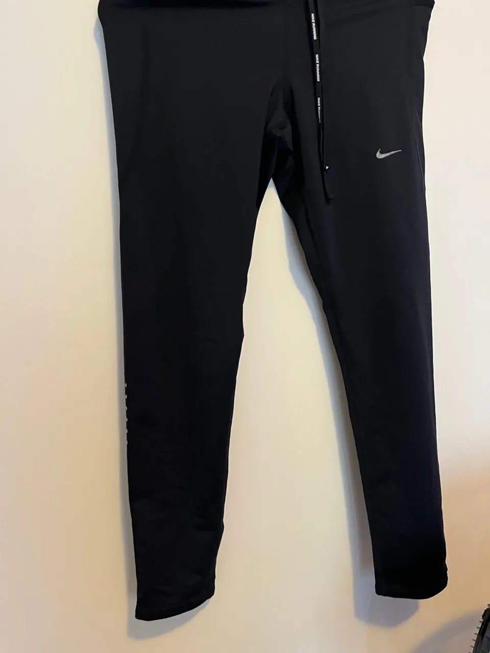 Calça de corrida Nike preta
