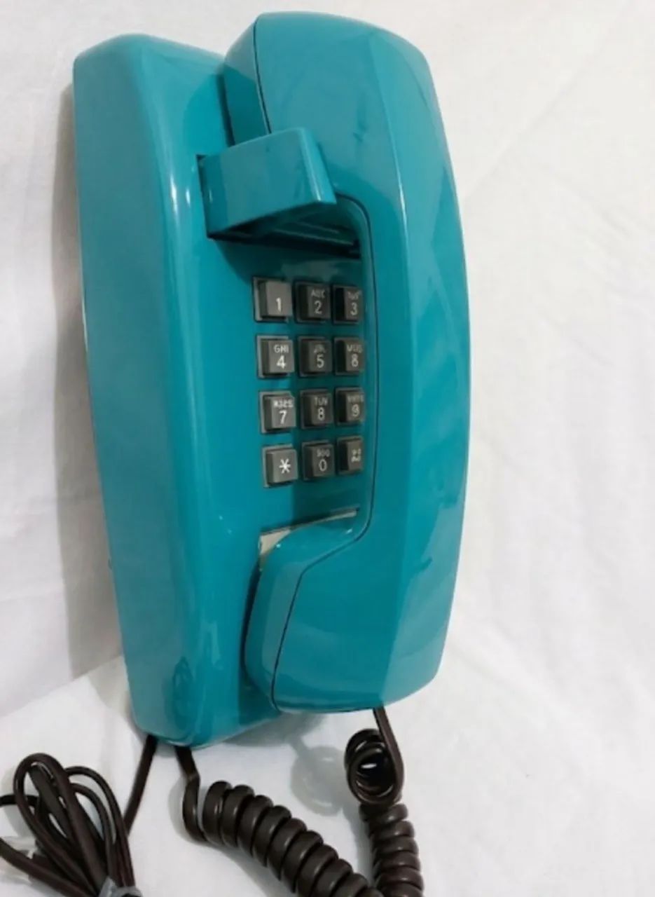 Telefone antigo funcionando azul turquesa 