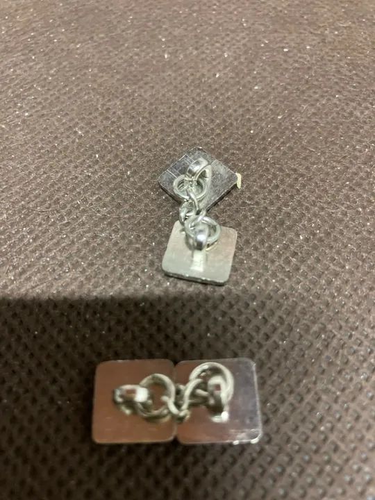 Par de abotoaduras em aço 