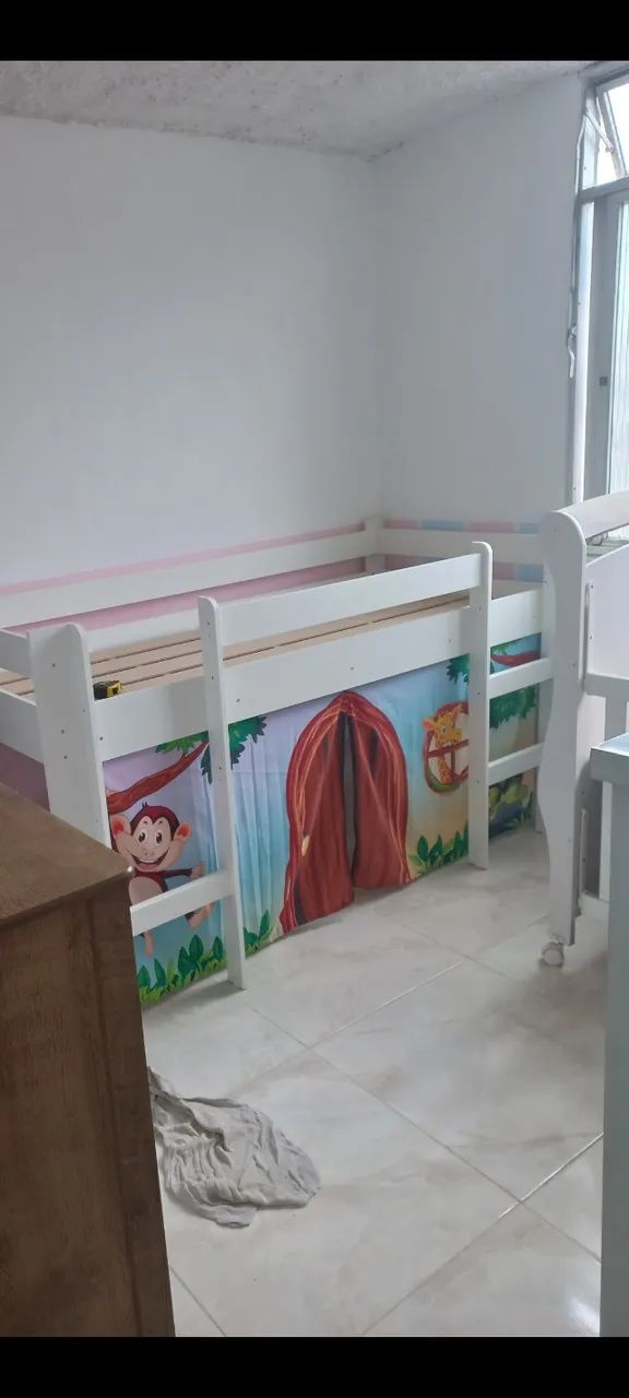 Single bed with playhouse and slide.