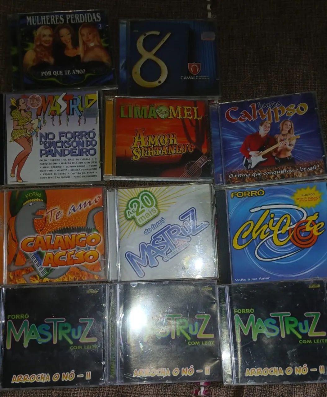 Old Forró CDs: Mastruz, Noda de Caju, Mel com Terra, and Banda Aquarius