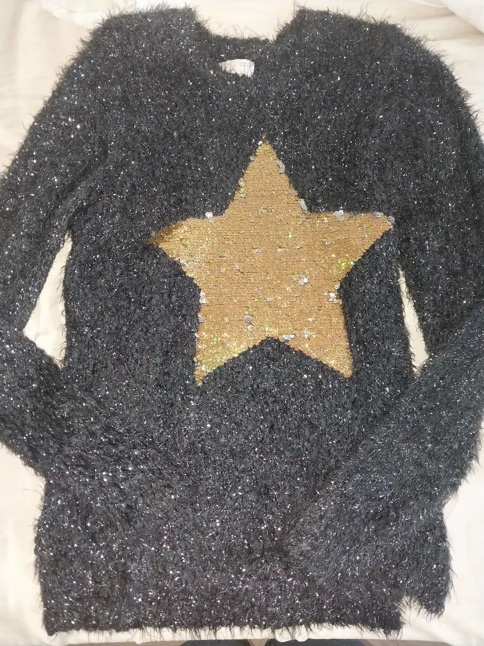 Blusa de pelinho com estrela de paetês